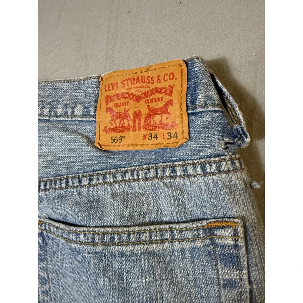 Levi's 569 Loose Straight Mens Jeans 34x34 Light Wash Blue Distressed Good